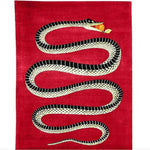 A striking Retro Red Snake Hand Tufted Wool Rug featuring a bold black and white snake design on a vibrant red background. Perfect for adding a vintage touch to a dining room or as a statement area rug in a large living room. This wool rug combines style and texture, ideal for both living rooms and formal dining rooms.