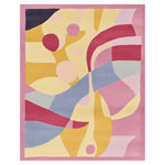 Modern nursery with colorful rug, blue sofa, and abstract art on patterned walls.