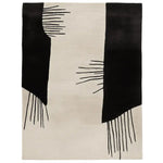 This contemporary area rug, titled 'Soft Ink Surge Hand Tufted Rug', showcases a striking abstract design with bold black and white patterns. Perfect for adding a modern touch to any space, this wool rug is ideal for large living rooms, especially in an 8x10 size configuration.