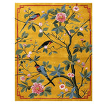 The Songbird Blossom Dance hand-tufted area rug features a vibrant design of colorful birds perched on branches with pink blossoms on a rich yellow backdrop. This contemporary wool rug is perfect for adding a splash of nature to your living room, ideal as an 8x10 living room rug.