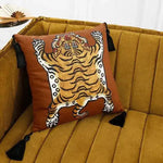 Tassel Tibetan tiger throw pillow cover in caramel color featuring a playful tiger design, perfect for adding a unique accent to your living space.