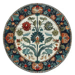 The Blossom Grace Hand Tufted Round Rug is a stunning wool rug, perfect for dining room or living room spaces. This area rug features an intricate floral design with vibrant colors, making it an ideal choice for dining room carpets and adding elegance to your home decor.