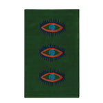A vibrant green area rug featuring a unique design of three abstract blue and orange eyes. This hand-tufted wool rug adds a touch of vintage charm, perfect for enhancing spaces like kitchens, hallways, or bedrooms. Ideal as a bathroom runner rug or a stylish addition to any bedroom decor.