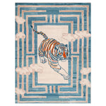 A vibrant Tiger Blossom Canopy Hand Tufted Wool Rug featuring an abstract tiger design in the center, surrounded by soft blue and cream geometric patterns. Perfect as a centerpiece in large living room rugs, this area rug for living rooms blends art and comfort in a wool rug.