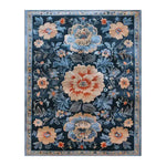 Verdant Tapestry Hand Tufted Rug featuring an elegant floral design, perfect as a dining room area rug. This vintage-inspired wool rug showcases a beautiful array of flowers on a dark background, creating a stunning and inviting atmosphere.