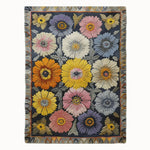 The Victorian Vignette Hand Tufted Wool Rug showcases an intricate floral pattern with vibrant colors, perfect for adding a vintage touch to your living room decor. This area rug, ideal for large living spaces, combines the elegance of a wool rug with the charm of vintage design, making it a standout piece among living room area rugs.