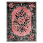 This Vintage Blushed Bloom Hand Tufted Rug features a stunning floral design with lush pink roses and green leaves, perfect for adding a touch of elegance to any living room. This wool area rug embodies a vintage charm, ideal for those seeking rugs for living room spaces that combine style and comfort.