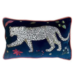 Decorative throw pillow featuring a walking leopard design on a deep blue background, adorned with colorful jungle accents and floral embroidery.