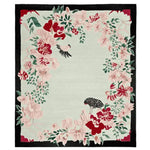 A beautifully crafted area rug featuring a floral design with pink and red blossoms against a soft green background. This wool rug is perfect for large living room spaces, adding elegance and warmth with its intricate hand-tufted details.