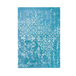 Elegant hand-tufted area rug in a soothing blue color, featuring intricate white floral patterns. Ideal for a large living room or bedroom, this vintage-inspired wool rug adds a touch of sophistication to any decor. Perfect as a living room rug in an 8x10 size, it brings a classic yet contemporary feel to your space.
