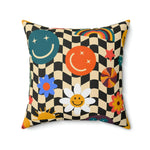 Colorful checker smiley emojis printed throw pillow featuring vibrant flowers, suns, and abstract shapes on a black and cream checkered background.