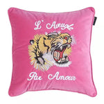 Embroidered tiger and floral design throw pillow cover in vibrant pink, adding a bold accent to any decor.