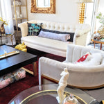 Extra skinny throw pillow with tassels in perfect white, adding a touch of elegance to modern living room decor.