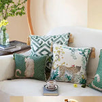 Leopard in the jungle throw pillow cover with golden tassels, featuring vibrant animal and floral designs, perfect for home decor.