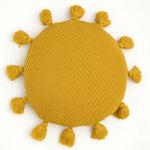 Round yellow decorative throw pillow with tassels around the edge, perfect for adding a pop of color to any room.