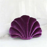 Purple sea shell plush stuffed pillow designed as a decorative throw pillow for home decor.
