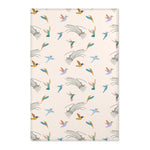 Patterned rug with colorful bird design on a beige background