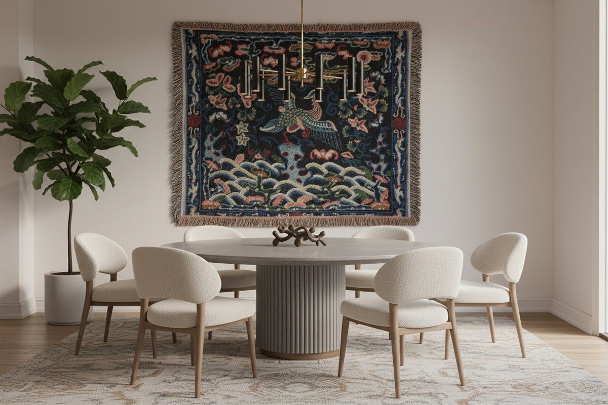 A square woven throw blanket with fringed edges, featuring a dark navy blue background with a detailed multicolor pattern of a flying crane, lotus flowers, and waves.