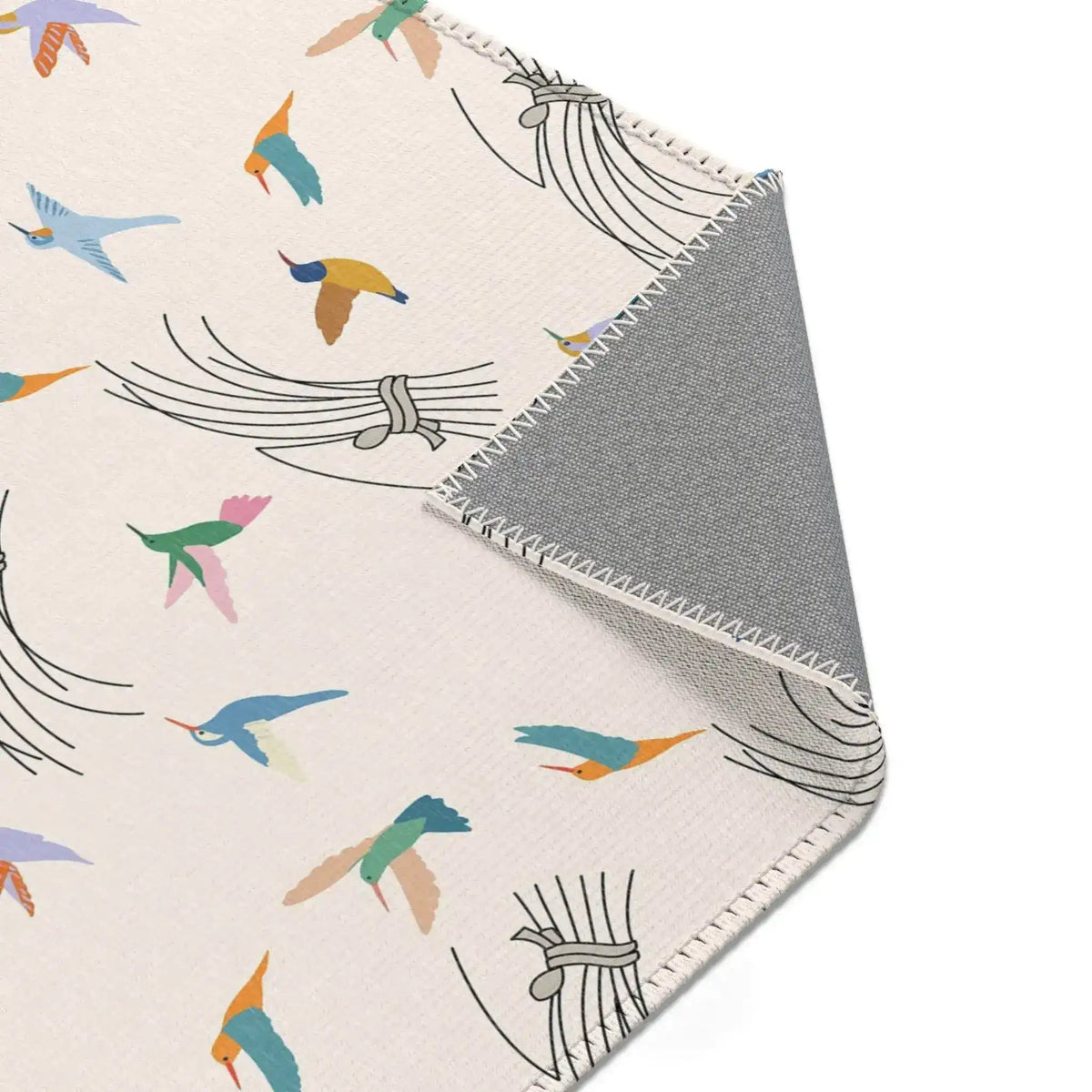 Textile with colorful bird pattern and gray border on a white background