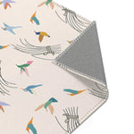 Textile with colorful bird pattern and gray border on a white background
