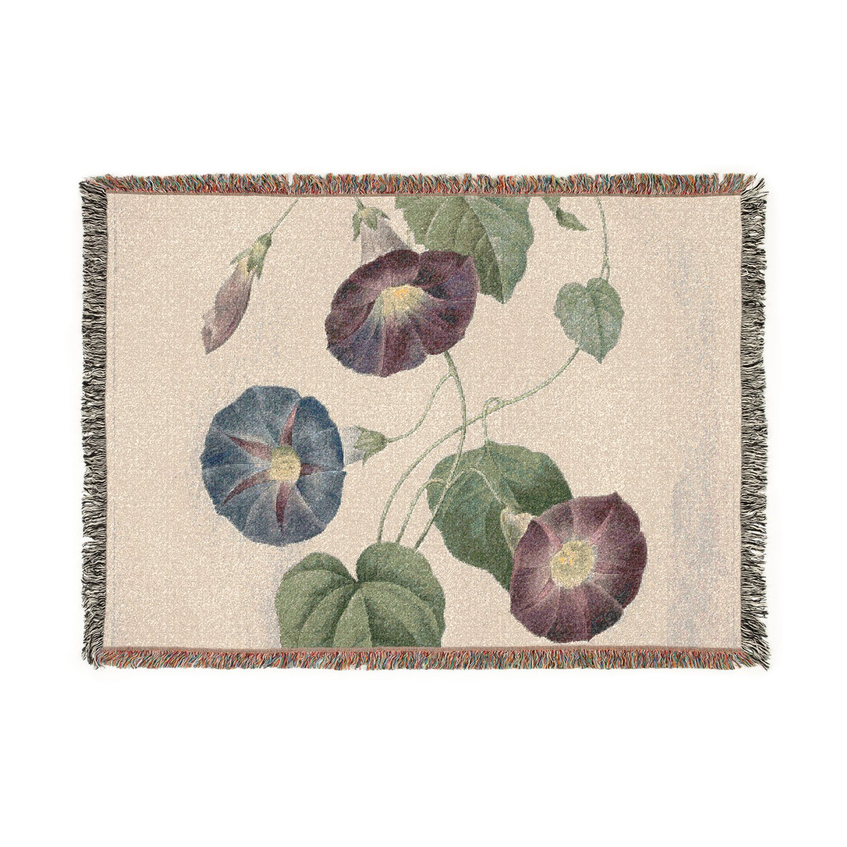 A woven throw blanket with a natural beige background and a botanical pattern of purple and blue morning glory flowers with green leaves, finished with fringed edges.