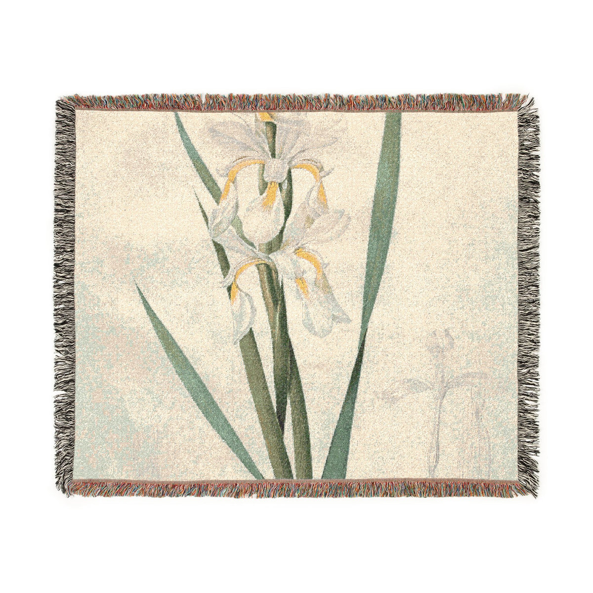 A woven throw blanket featuring a botanical design of white irises with green leaves on a textured cream background, finished with fringed edges.