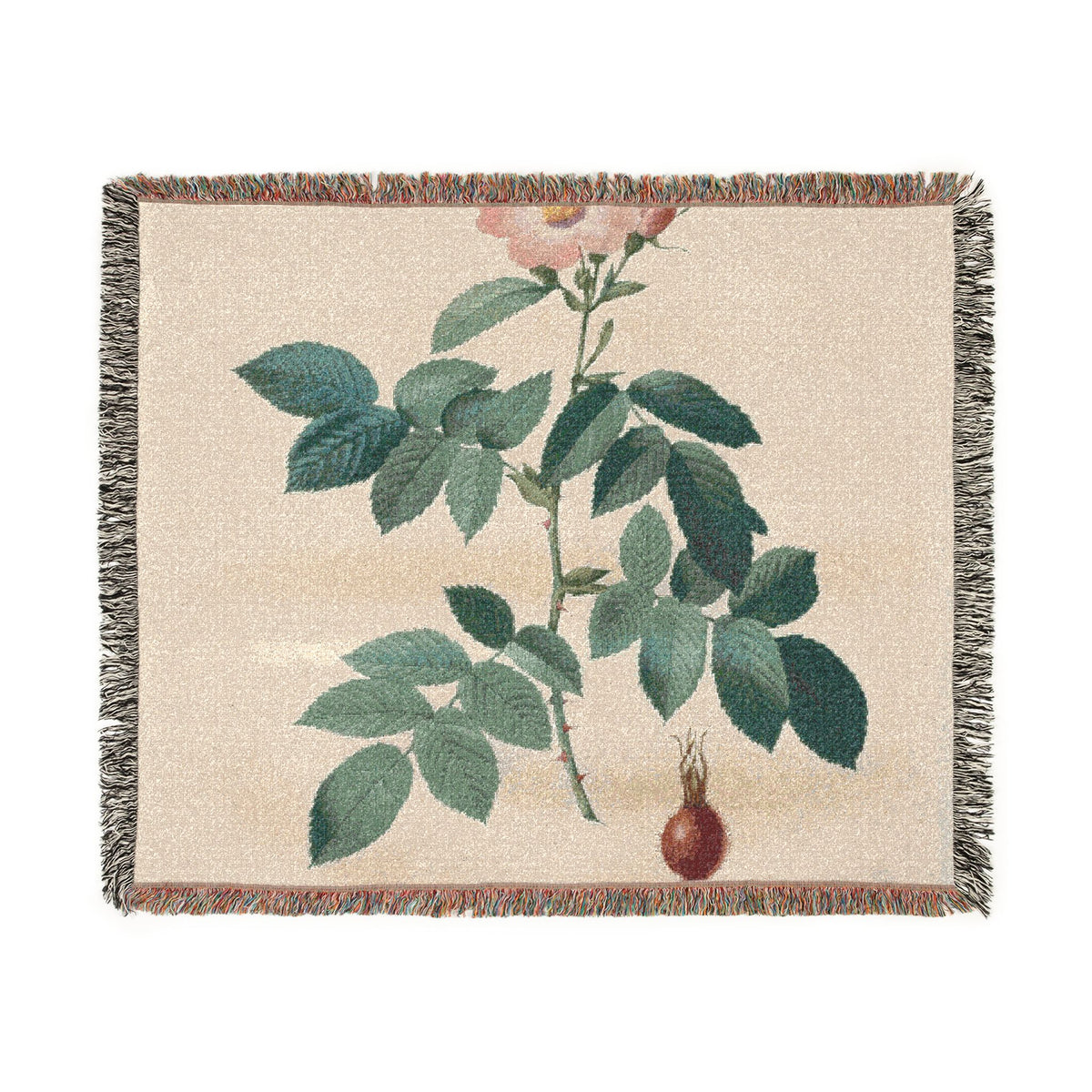 A rectangular woven throw blanket with fringed edges, featuring a botanical print of a green leafy stem with a pale pink flower bud and a small brown gourd on a warm beige background.