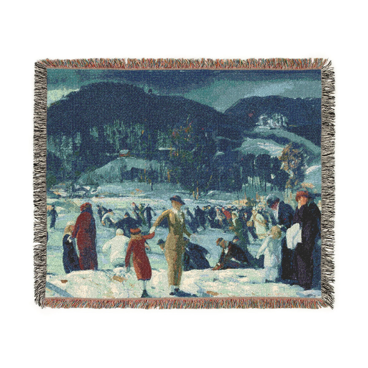A woven throw blanket featuring a winter landscape scene with people ice skating, dark blue hills in the background, and fringed edges, shown against a plain white background.