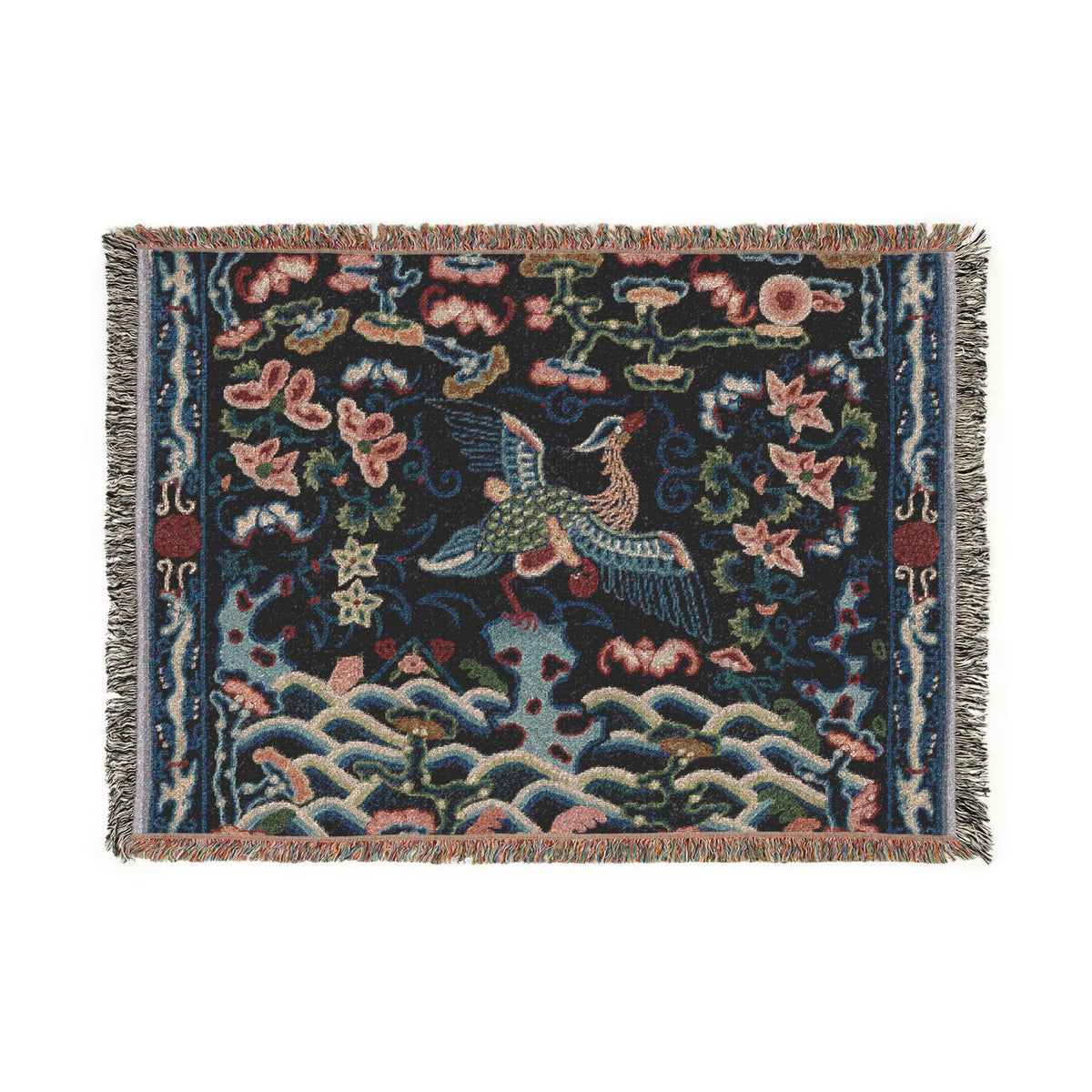 A square woven textile with fringe on all sides, featuring a dark navy background and an intricate multicolor pattern of a flying bird, waves, flowers, and decorative motifs.