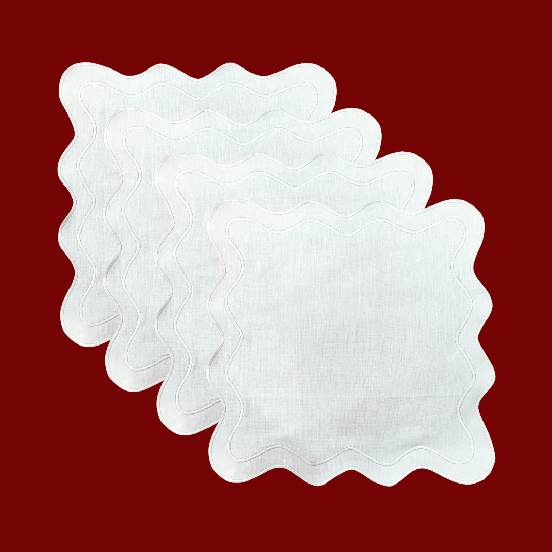 Elevate your dining experience with this white scallop 100% linen square placemat. Its elegant design and high-quality linen construction add sophistication to any table setting. Perfect for both casual meals and formal occasions, it brings a touch of timeless beauty to your dining decor.