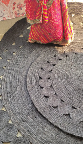 walking on black round jute rug