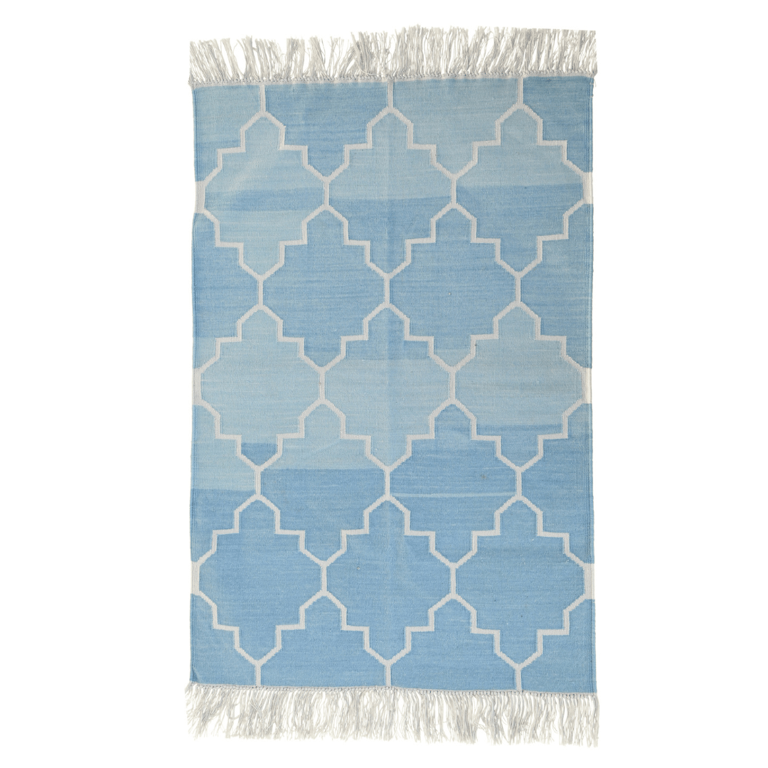 Introduce exotic charm with this handwoven blue and white Moroccan-patterned cotton rug. Its intricate design infuses spaces with cultural flair, while fringes add a delightful accent. Durable and soft, it brings both style and comfort to your home decor.