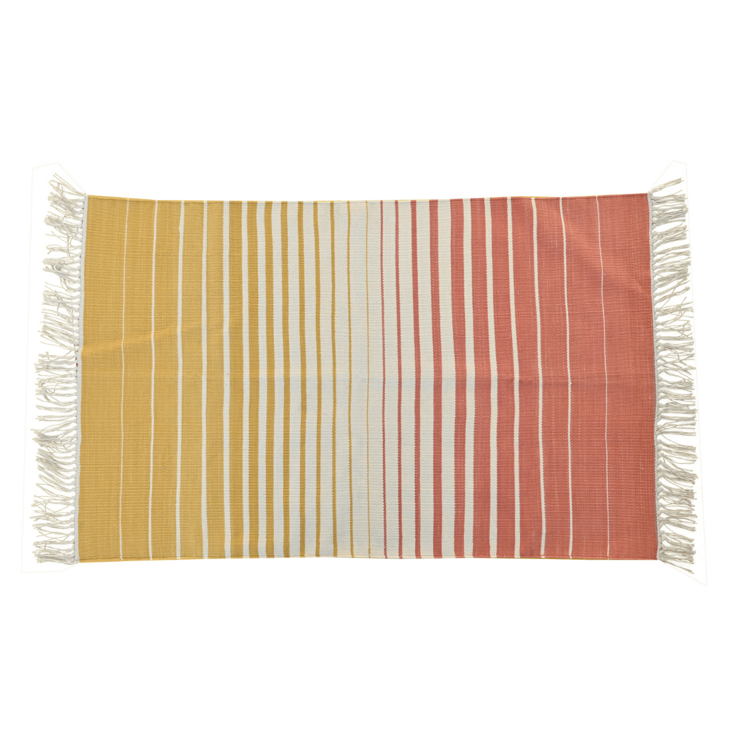 Illuminate your space with this handwoven yellow and orange ombre cotton rug. Its vibrant hues transition seamlessly, adding a dynamic touch to any room. Finished with fringes for a playful accent, this rug brings warmth and style to your home decor.