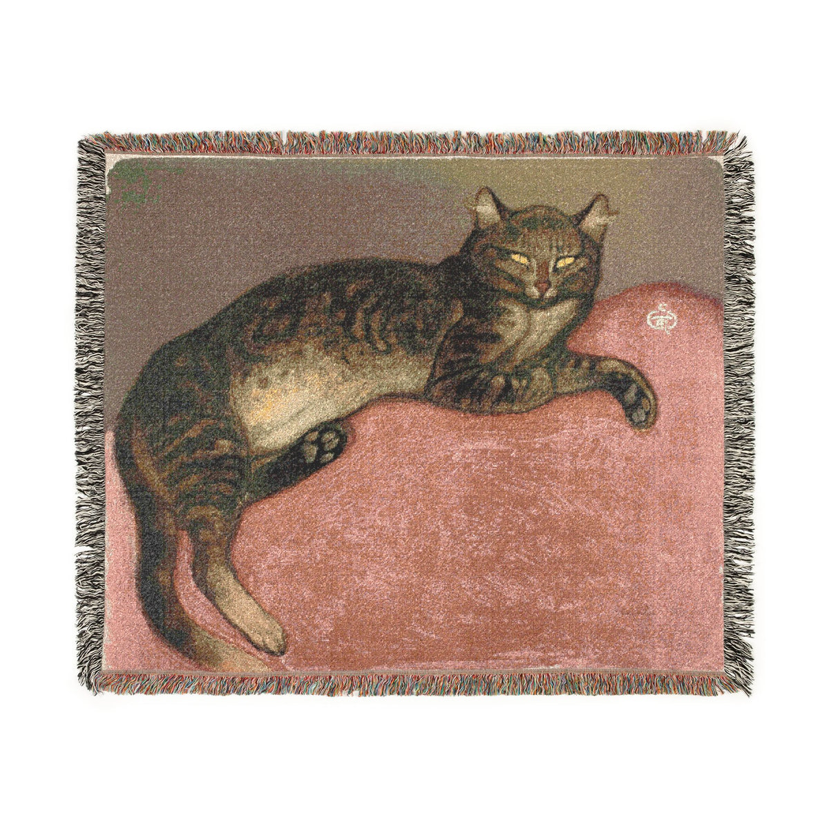 A woven throw blanket featuring a tabby cat lounging on a dusty pink cushion, finished with fringed edges.