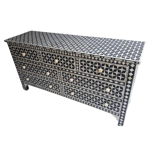 Elevate your space with Stellar Elegance Mother of Pearl Inlay 7 Drawers Chest. Experience modern sophistication with the Chic Lines 3 Drawers Chest. Make a statement with the Zebra Noir Bone Inlay 6 Drawers Chest. Transform your decor with the Botanical Blue Bone Inlay Coffee Table