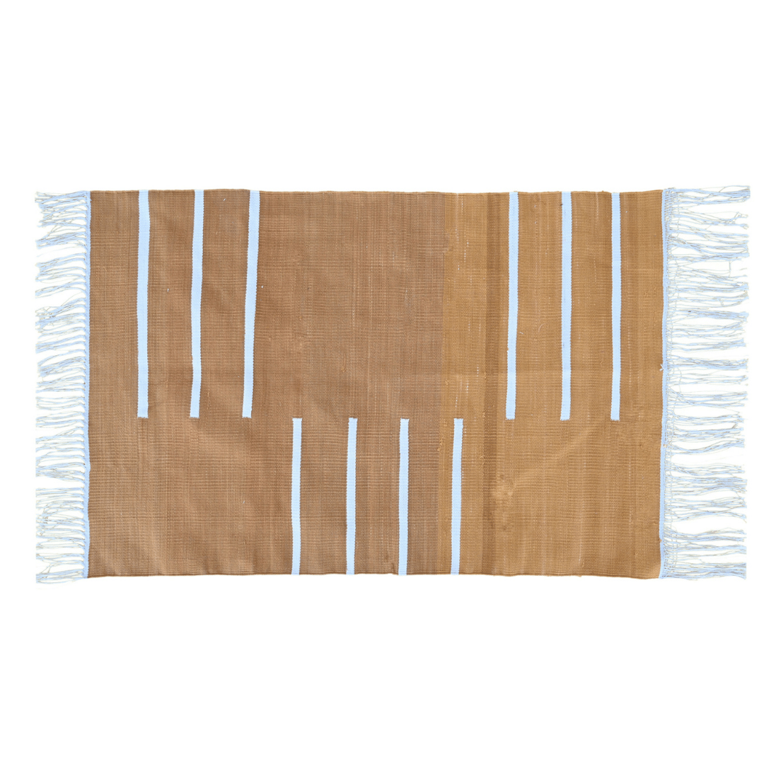 Enliven your space with the vibrant charm of the "Handwoven Turmeric and White Minimalistic Cotton Rug with Fringes." Its bold turmeric hue paired with clean white accents exudes modern sophistication, while the fringes add a playful detail. Handcrafted with care, this rug brings both style and comfort to any room in your home, creating a welcoming atmosphere with its warm and contemporary aesthetic.