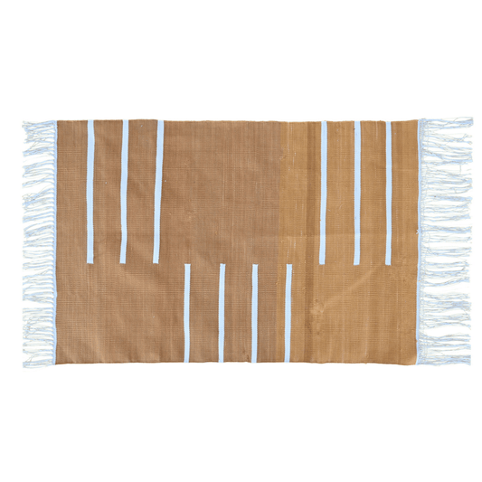 Enliven your space with the vibrant charm of the "Handwoven Turmeric and White Minimalistic Cotton Rug with Fringes." Its bold turmeric hue paired with clean white accents exudes modern sophistication, while the fringes add a playful detail. Handcrafted with care, this rug brings both style and comfort to any room in your home, creating a welcoming atmosphere with its warm and contemporary aesthetic.