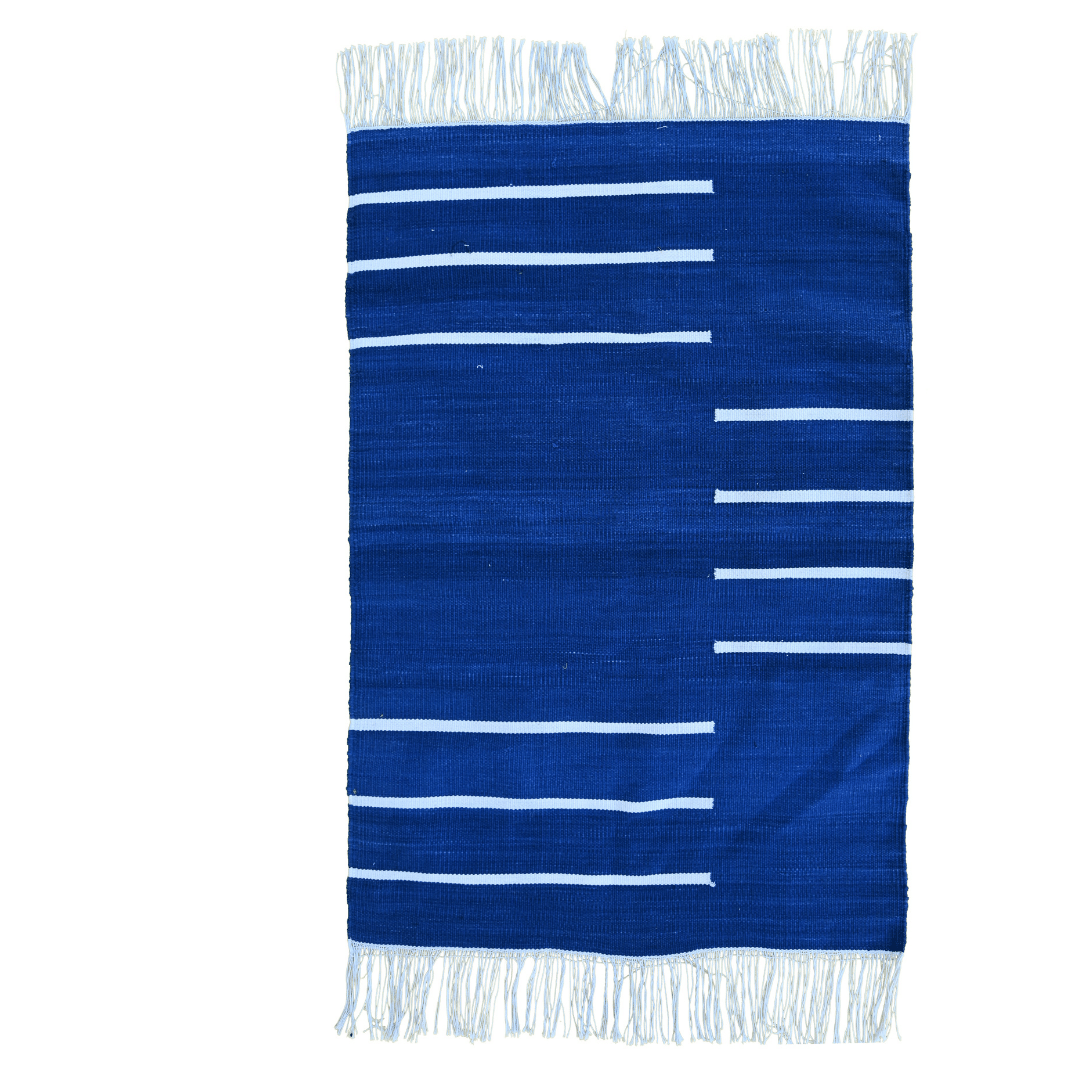 Elevate your space with the regal elegance of the "Handwoven Royal Blue and White Minimalistic Cotton Rug with Fringes." Its deep royal blue hue paired with crisp white accents exudes modern sophistication, while the fringes add a charming detail. Handcrafted with care, this rug brings both style and comfort to any room in your home, creating a luxurious and inviting atmosphere.
