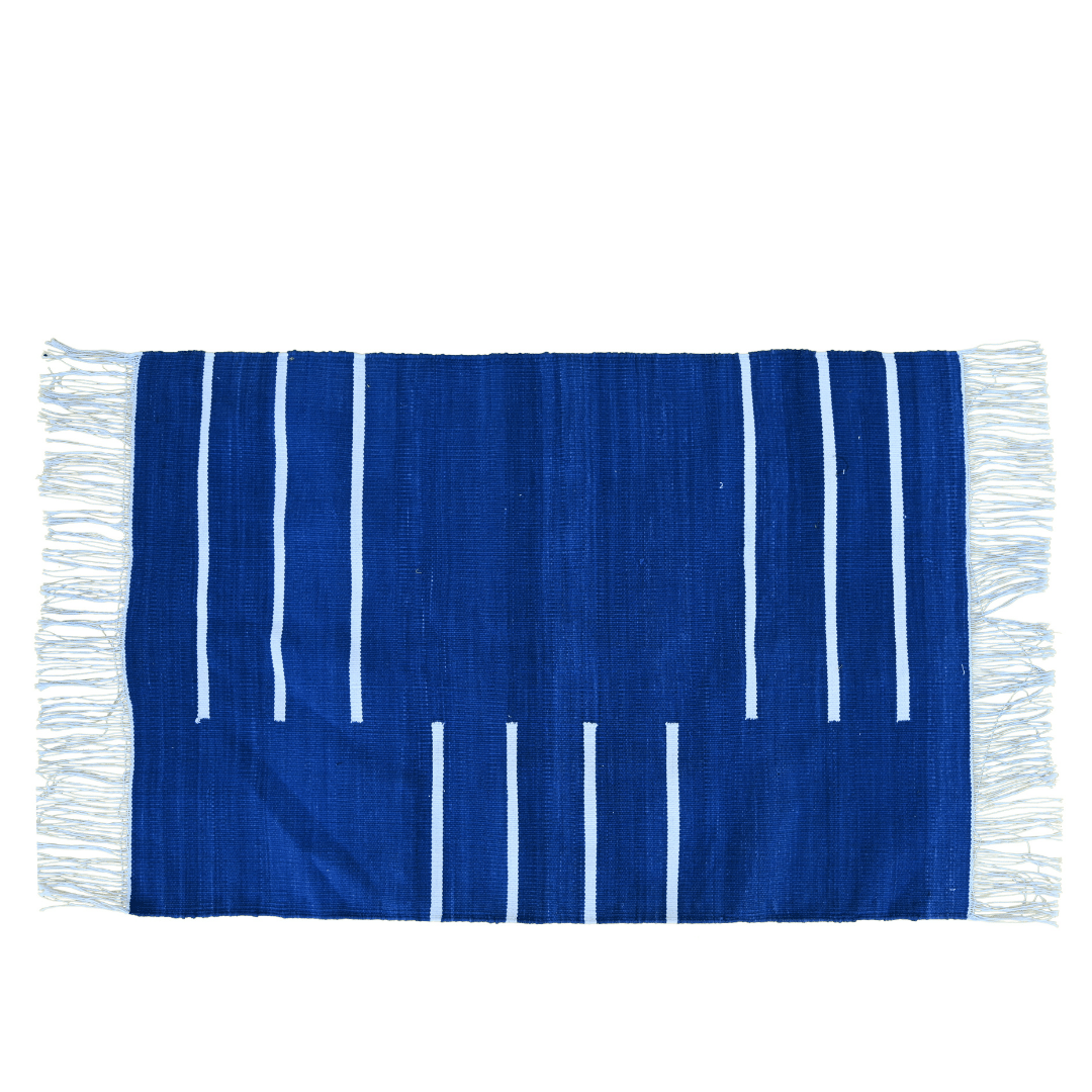 Elevate your space with the regal elegance of the "Handwoven Royal Blue and White Minimalistic Cotton Rug with Fringes." Its deep royal blue hue paired with crisp white accents exudes modern sophistication, while the fringes add a charming detail. Handcrafted with care, this rug brings both style and comfort to any room in your home, creating a luxurious and inviting atmosphere.