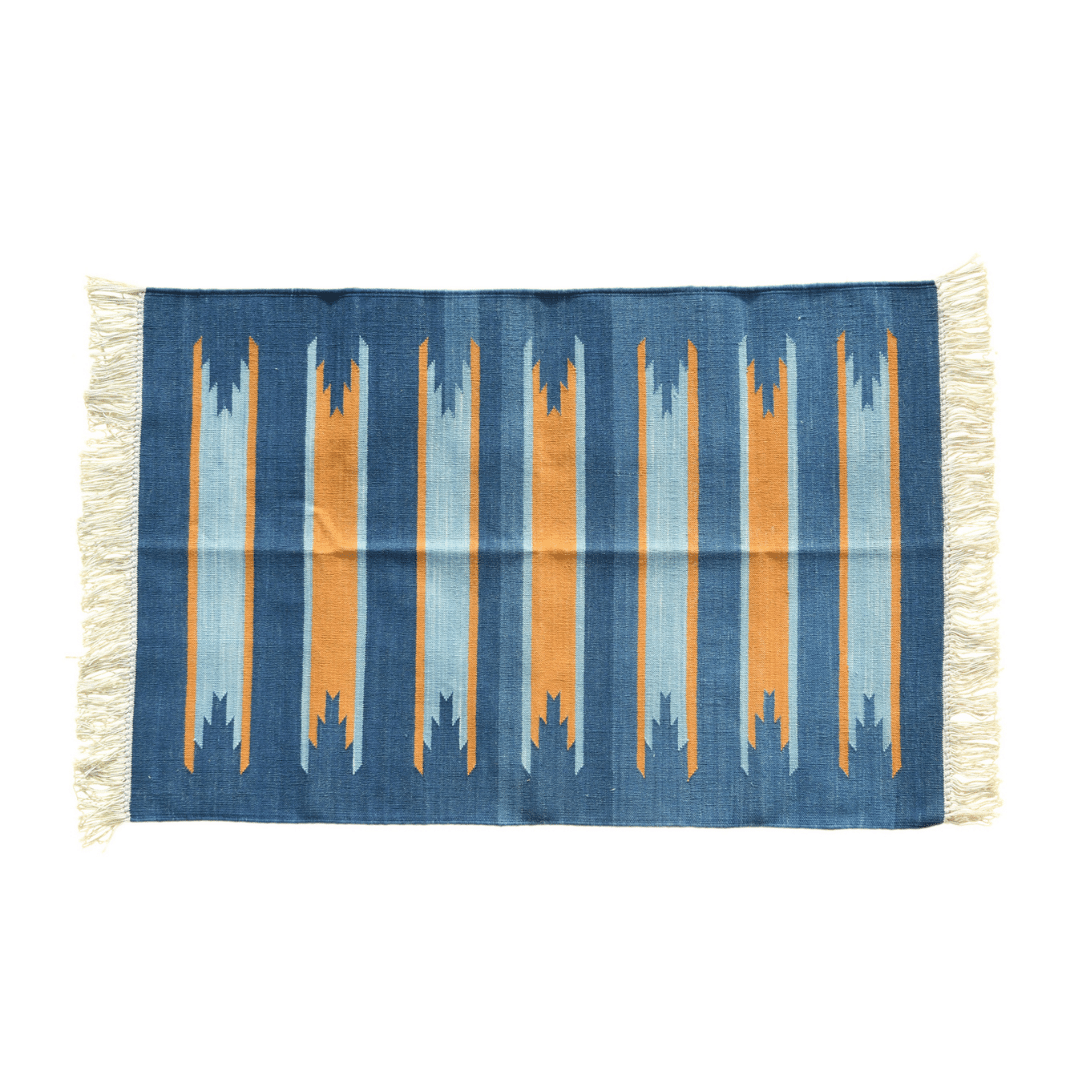 Immerse yourself in natural beauty with the "Handwoven Earth and Ocean Cotton Rug with Fringes." Its blend of earthy tones and oceanic hues creates a harmonious and serene atmosphere, while the fringes add a touch of texture and charm. Handcrafted with care, this rug brings the tranquility of nature into your home, enhancing any space with its calming presence.