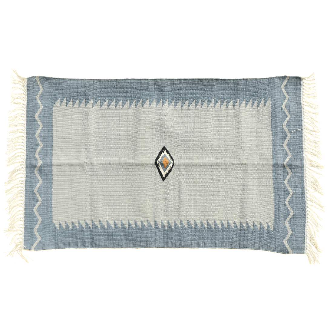 Add a touch of vintage charm to your space with the "Handwoven Minimalistic Vintage Gray Cotton Rug with Fringes." Its muted gray hue exudes understated elegance, while the fringes provide a nostalgic detail. Handcrafted with care, this rug brings both simplicity and character to any room in your home, creating a timeless and inviting atmosphere