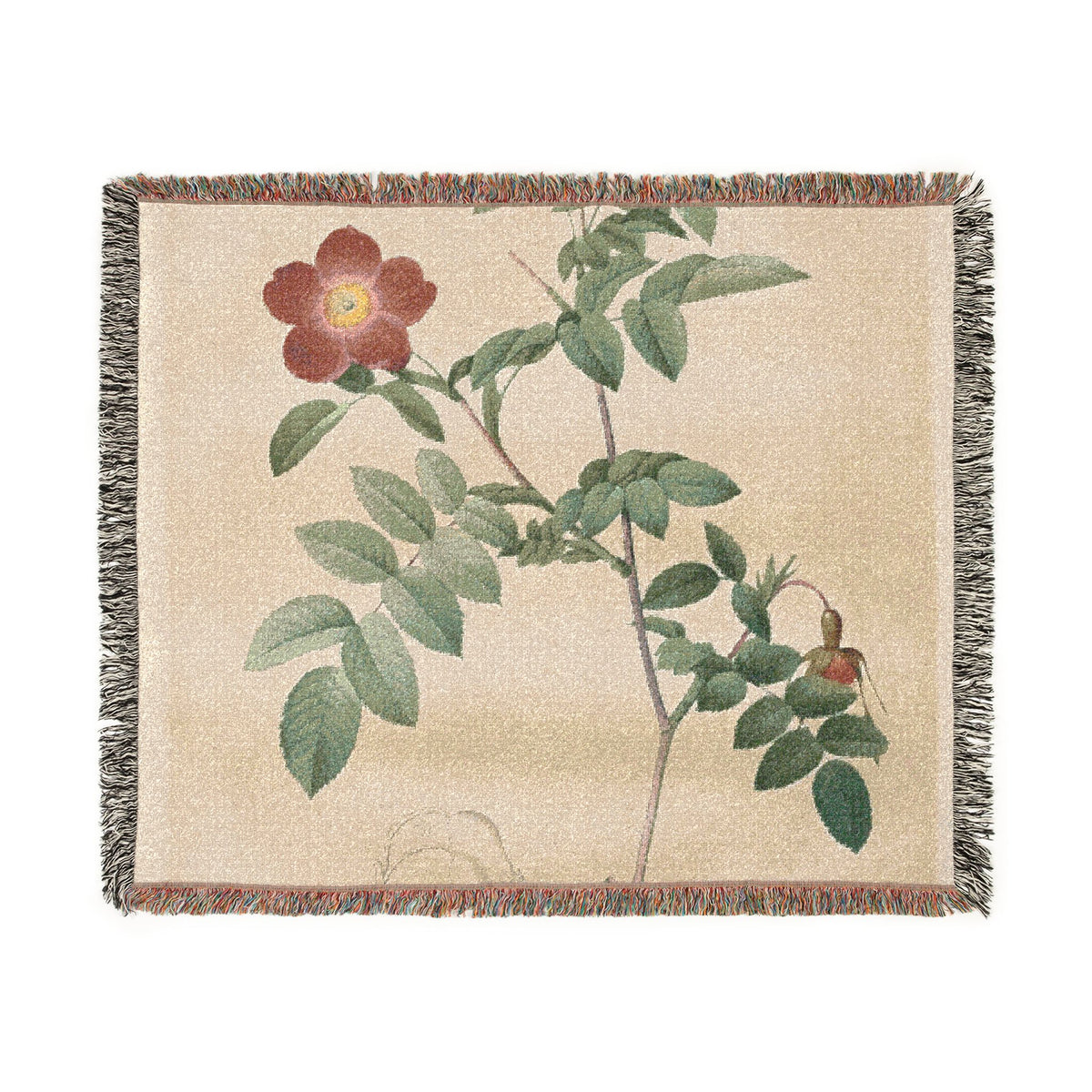 A woven throw blanket featuring a botanical print of a rose branch with green leaves and a reddish-brown flower on a beige background, finished with fringed edges.