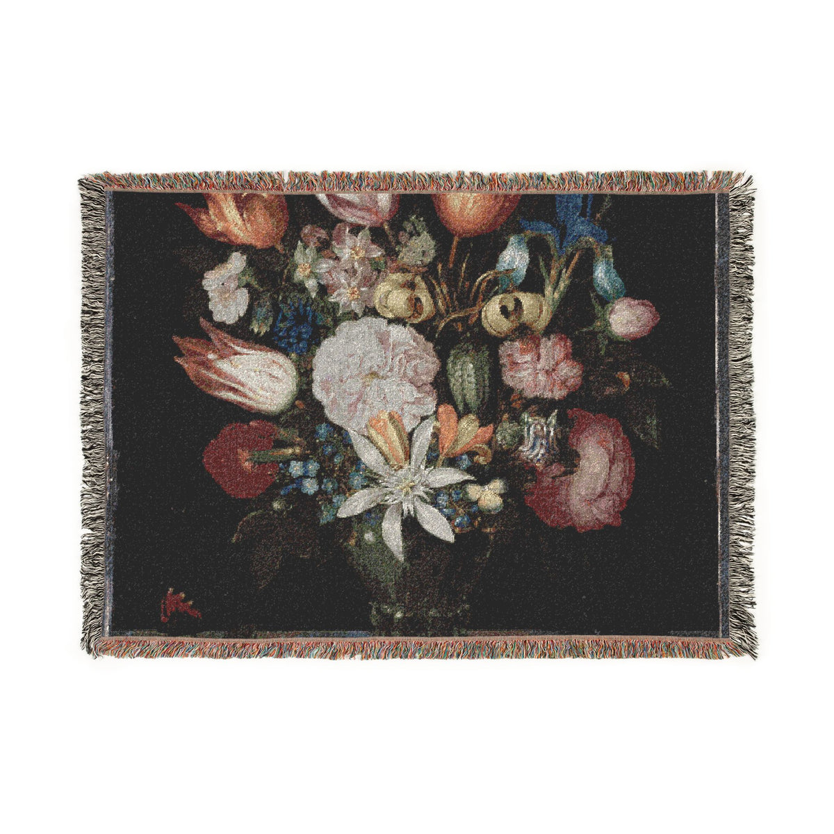 A rectangular woven tapestry with fringed edges featuring a classic still life floral bouquet on a dark background, shown flat against a white backdrop.