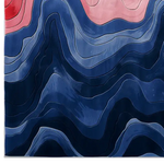Vibrant Chromatic Currents Hand Tufted Area Rug showcasing dynamic waves of blue and pink hues, creating a visually striking abstract design.