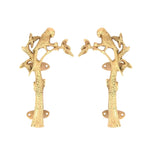 Pair of brass door pulls shaped as a parrot perched on a leafy tree branch