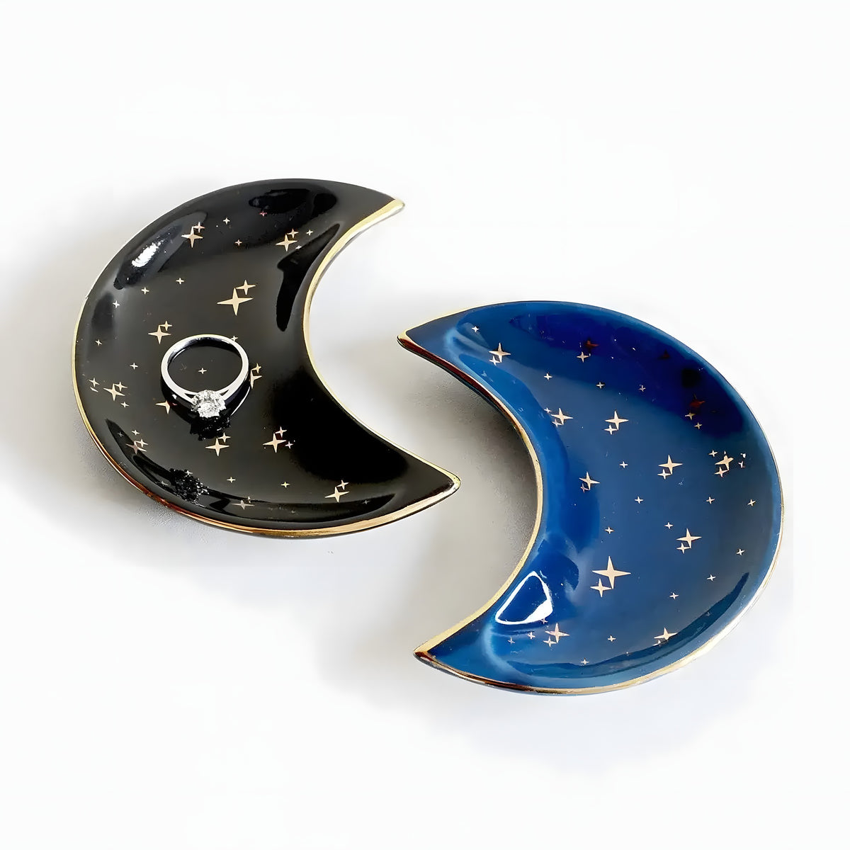 Black and blue crescent-moon ceramic trinket dishes with gold stars, ring inside
