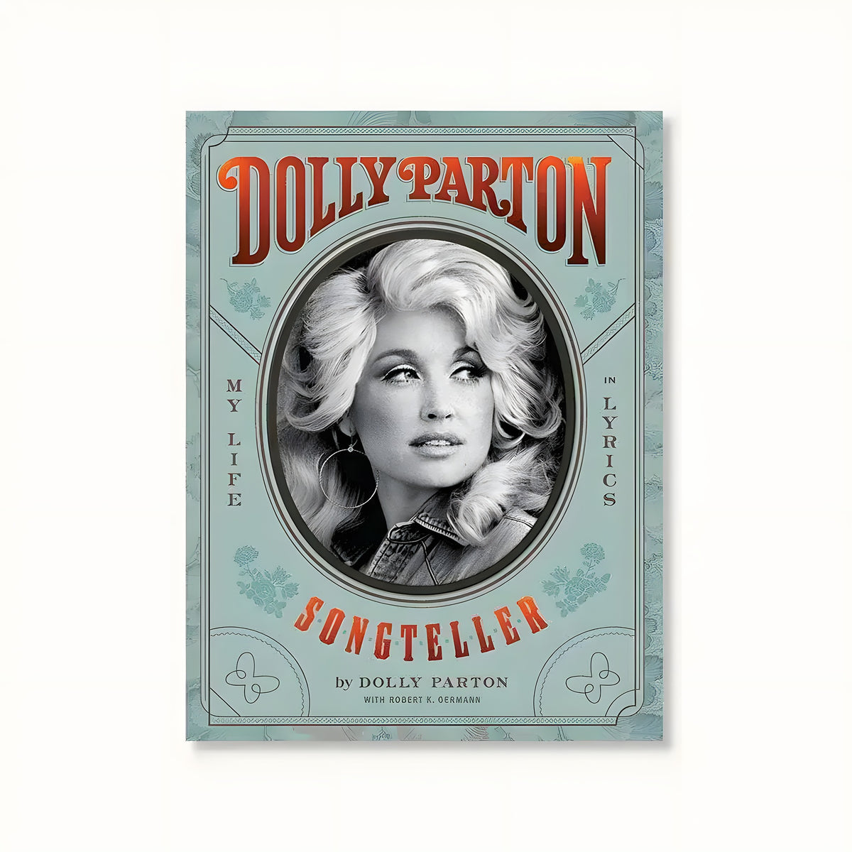 Dolly Parton Songteller book cover, teal with a vintage oval black-and-white portrait