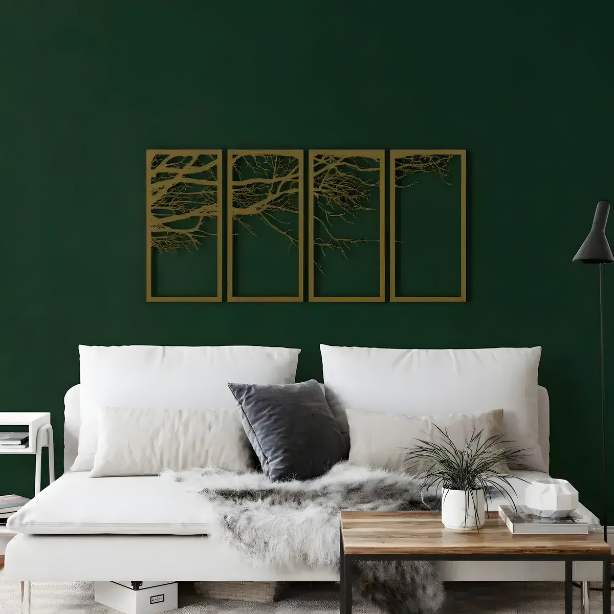 Gold four-panel Tree of Life metal art of spreading branches on a dark green wall