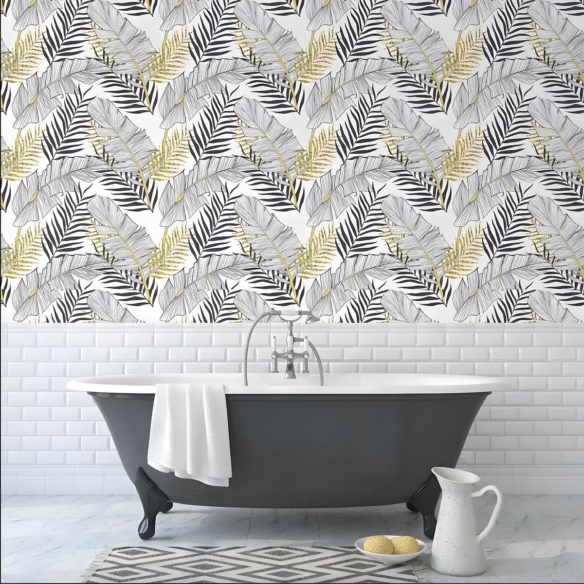 Gold contrast black palm leaves wallpaper in a bathroom above white subway tile and a gray clawfoot tub