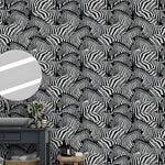 Black and white zebra wallpaper behind a dark bathroom vanity with round mirror